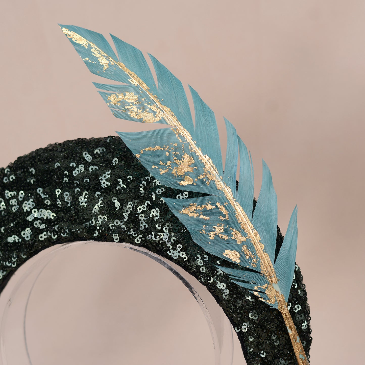 Sequin Bandeau Headband with Floating Gold Leaf Feather on a Deep Green