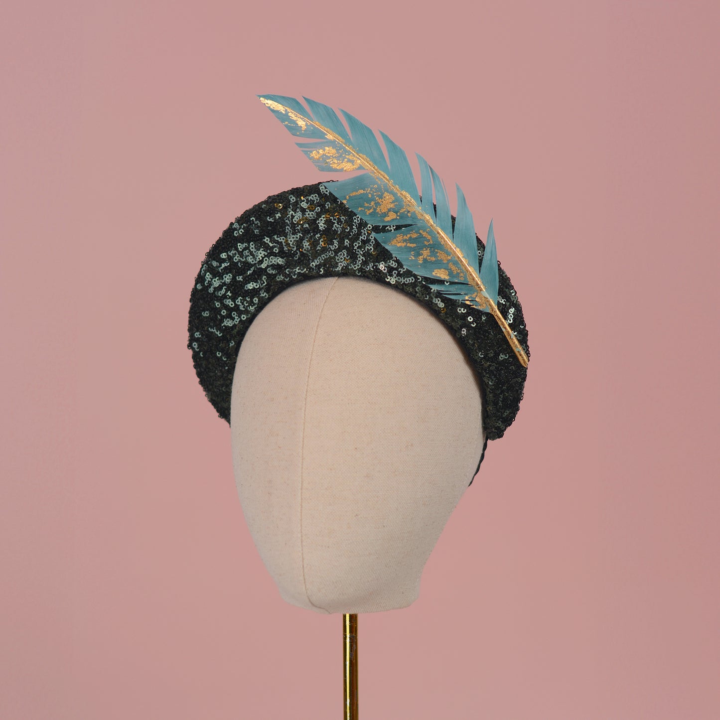 Sequin Bandeau Headband with Floating Gold Leaf Feather on a Deep Green