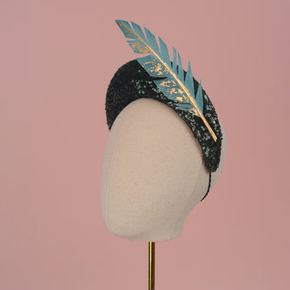 Sequin Bandeau Headband with Floating Gold Leaf Feather on a Deep Green
