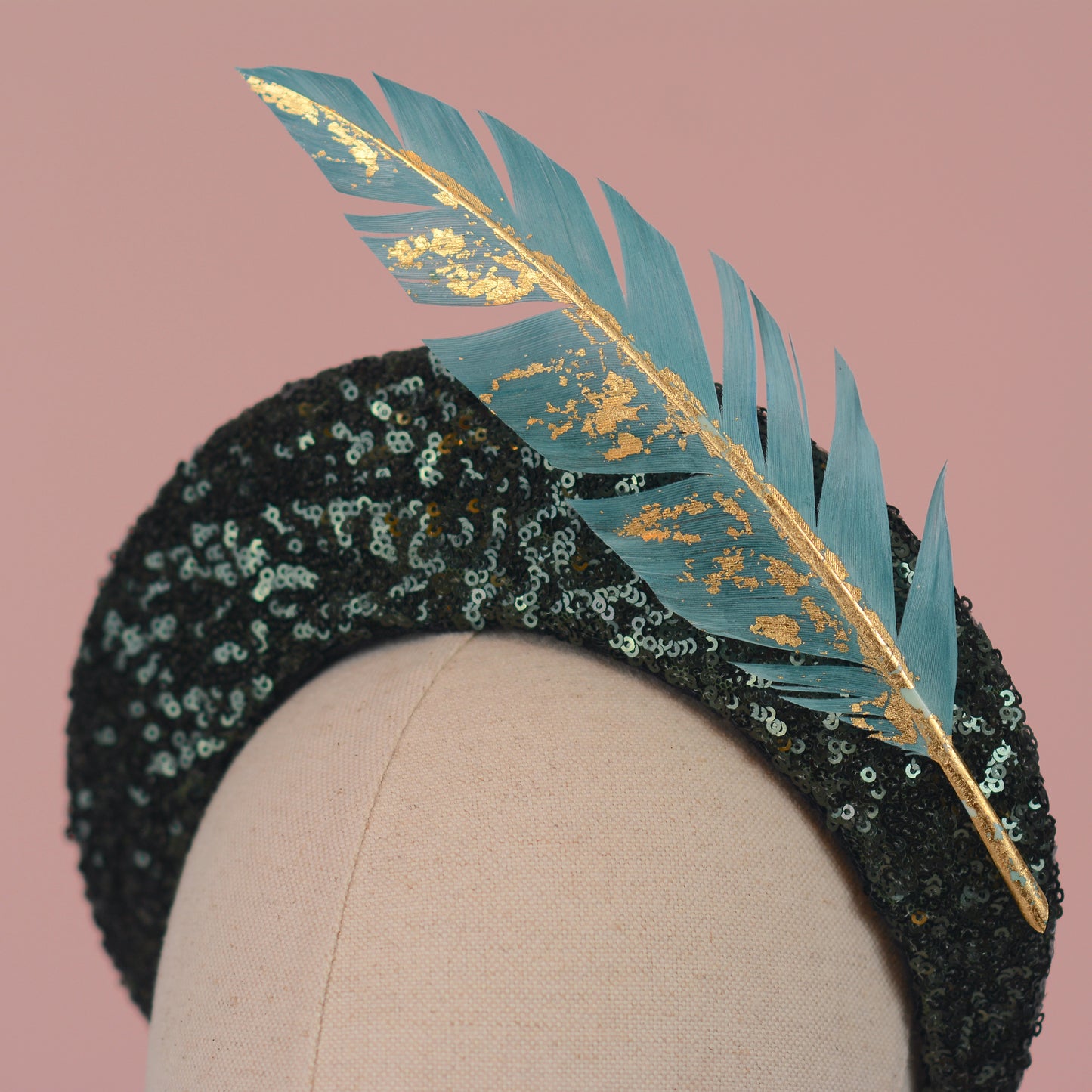 Sequin Bandeau Headband with Floating Gold Leaf Feather on a Deep Green