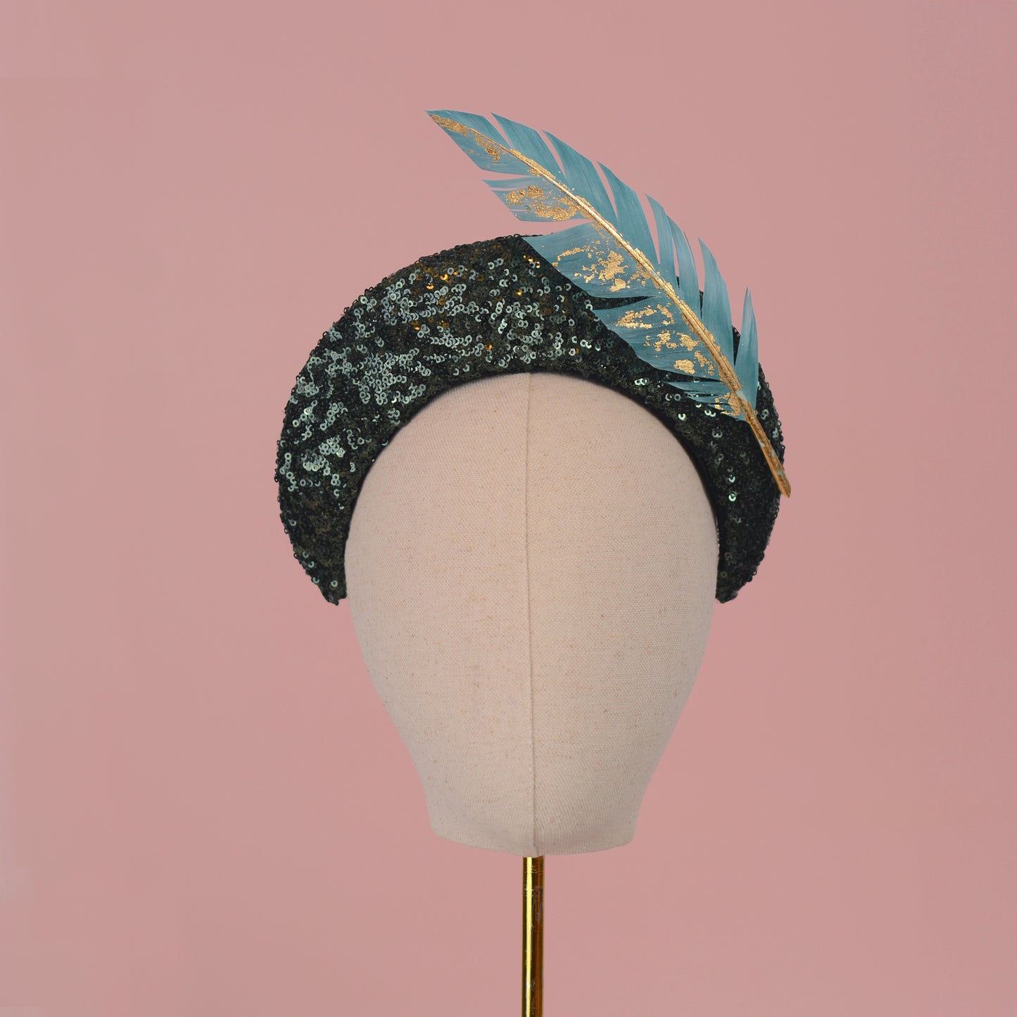 Sequin Bandeau Headband with Floating Gold Leaf Feather on a Deep Green