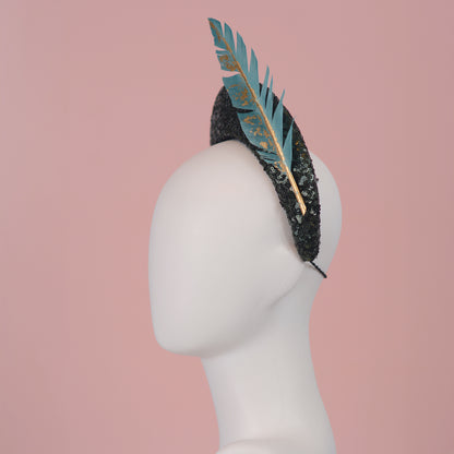 Sequin Bandeau Headband with Floating Gold Leaf Feather on a Deep Green