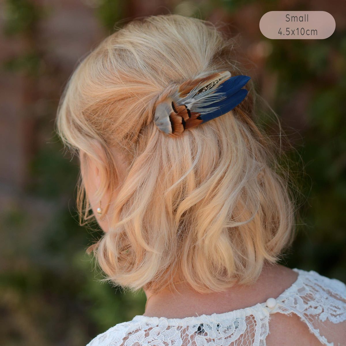 Pheasant and partridge feather hair clip in navy blue, copper and grey blue. A decorative hair accessory ideal for wedding guests