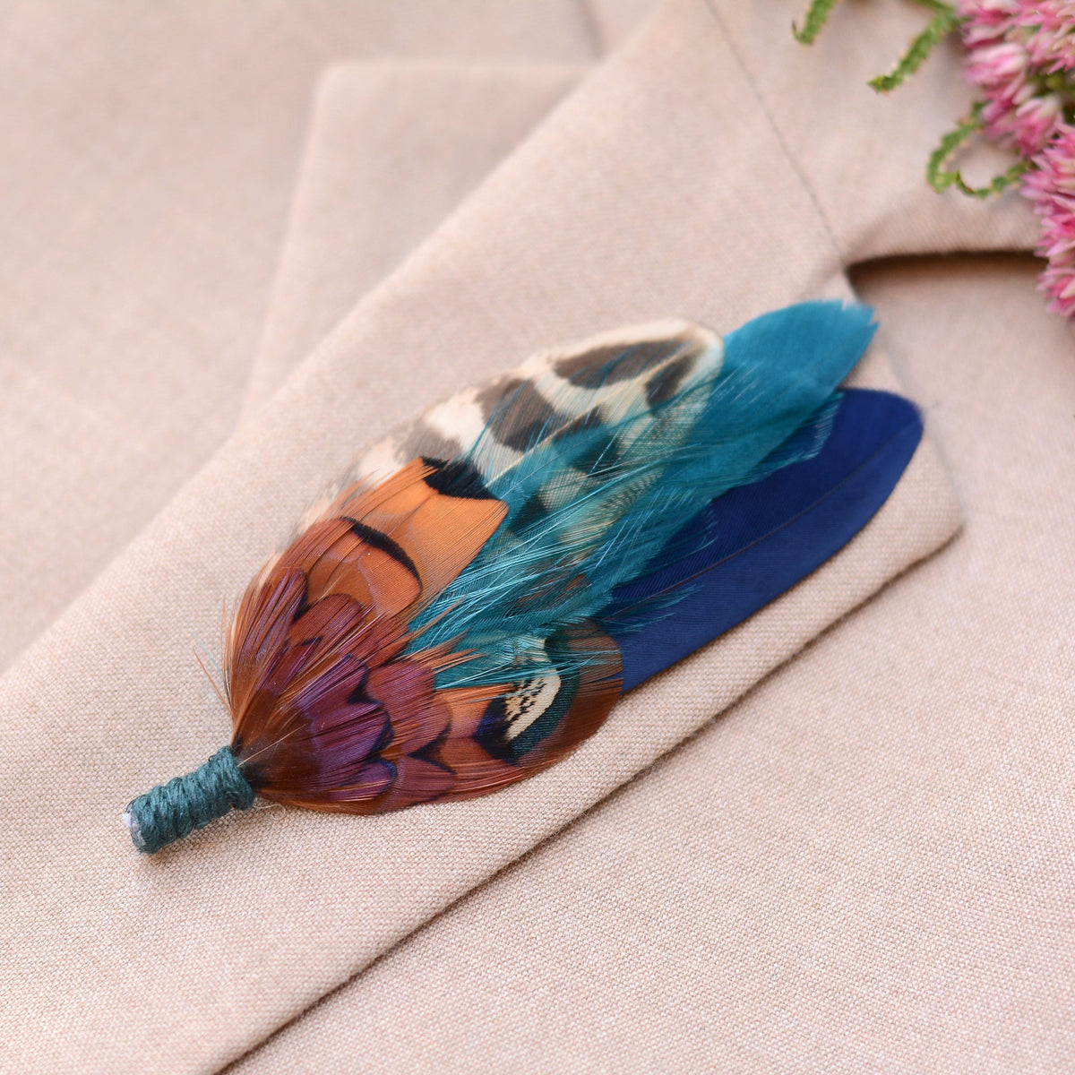 Pheasant feather lapel pin brooch in bright copper pheasant feathers paired with navy blue and teal. Ideal for groom's and groomsmen
