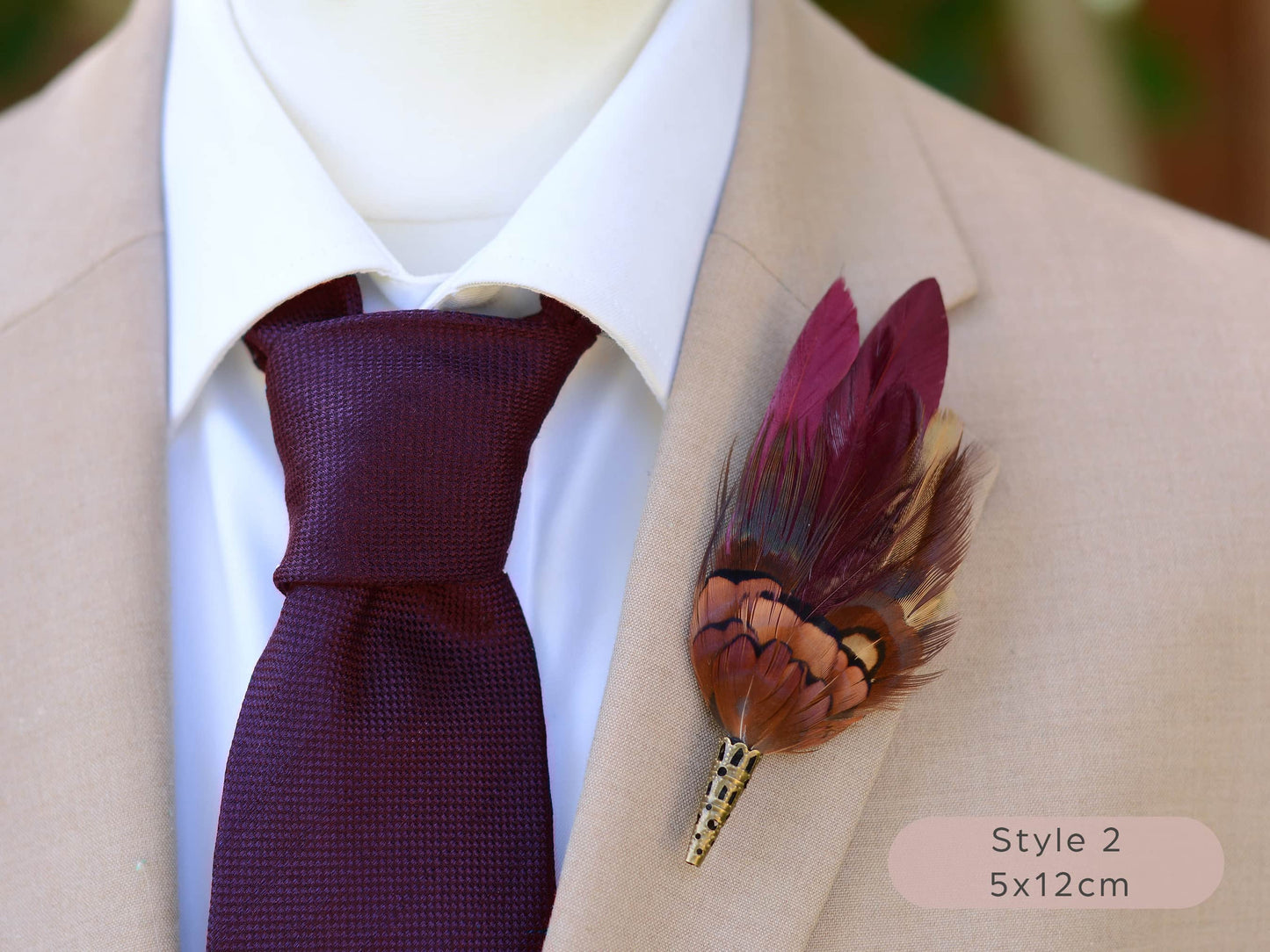 Burgundy and pheasant Feather lapel pin buttonhole on a suit jacket with a purple tie