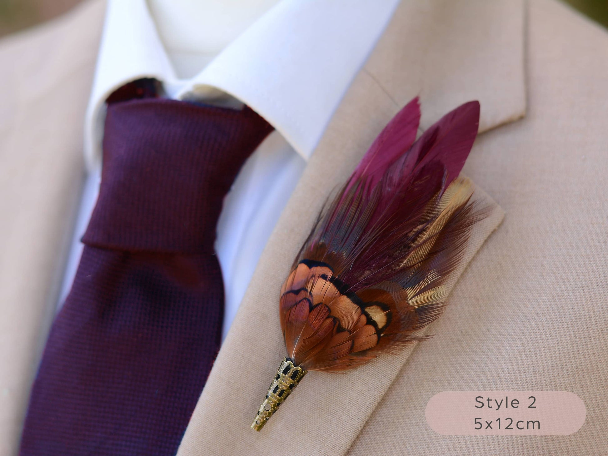 Burgundy and pheasant Feather lapel pin buttonhole on a suit jacket with a purple tie