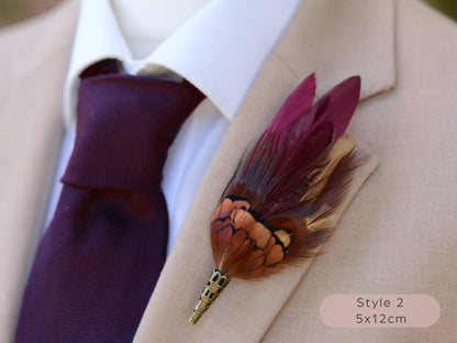 Burgundy and pheasant Feather lapel pin buttonhole on a suit jacket with a purple tie