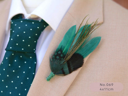 Green feathered boutonniere on a suit lapel with a green tie and white shirt.