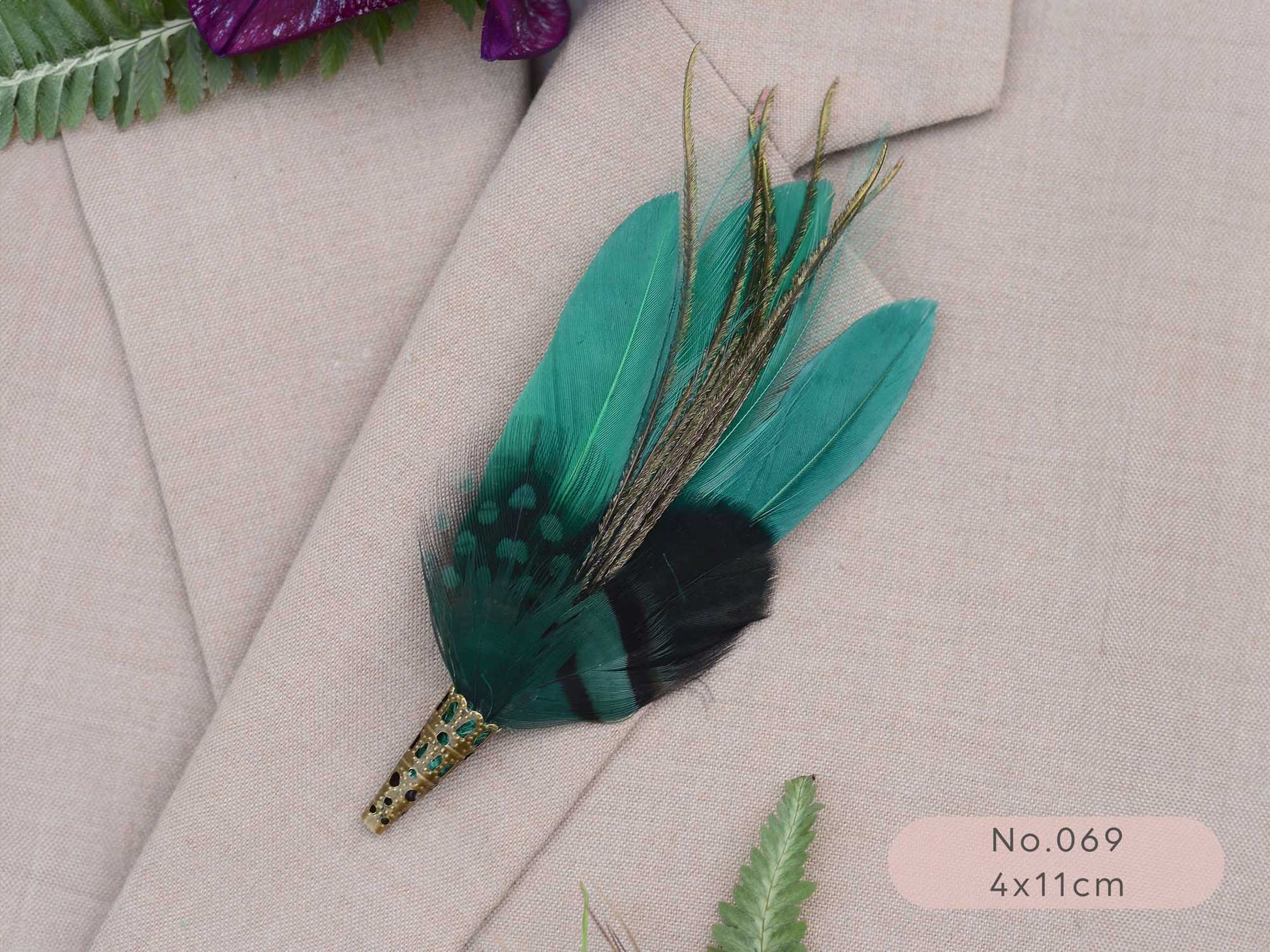 Green feathered boutonniere on a beige suit jacket with a label indicating size.