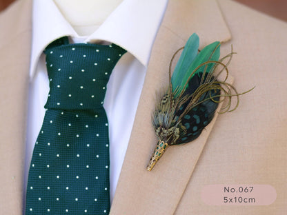 Man wearing a green polka dot tie and beige suit with a green feather boutonniere.