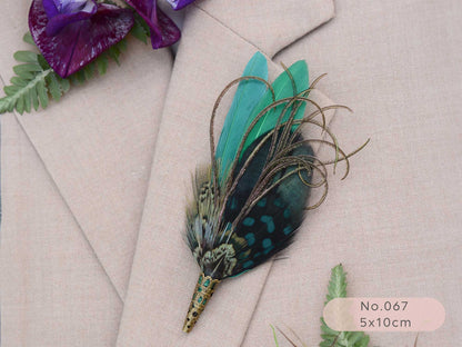 Green feathered boutonniere on a beige suit jacket with purple flowers and green leaves.