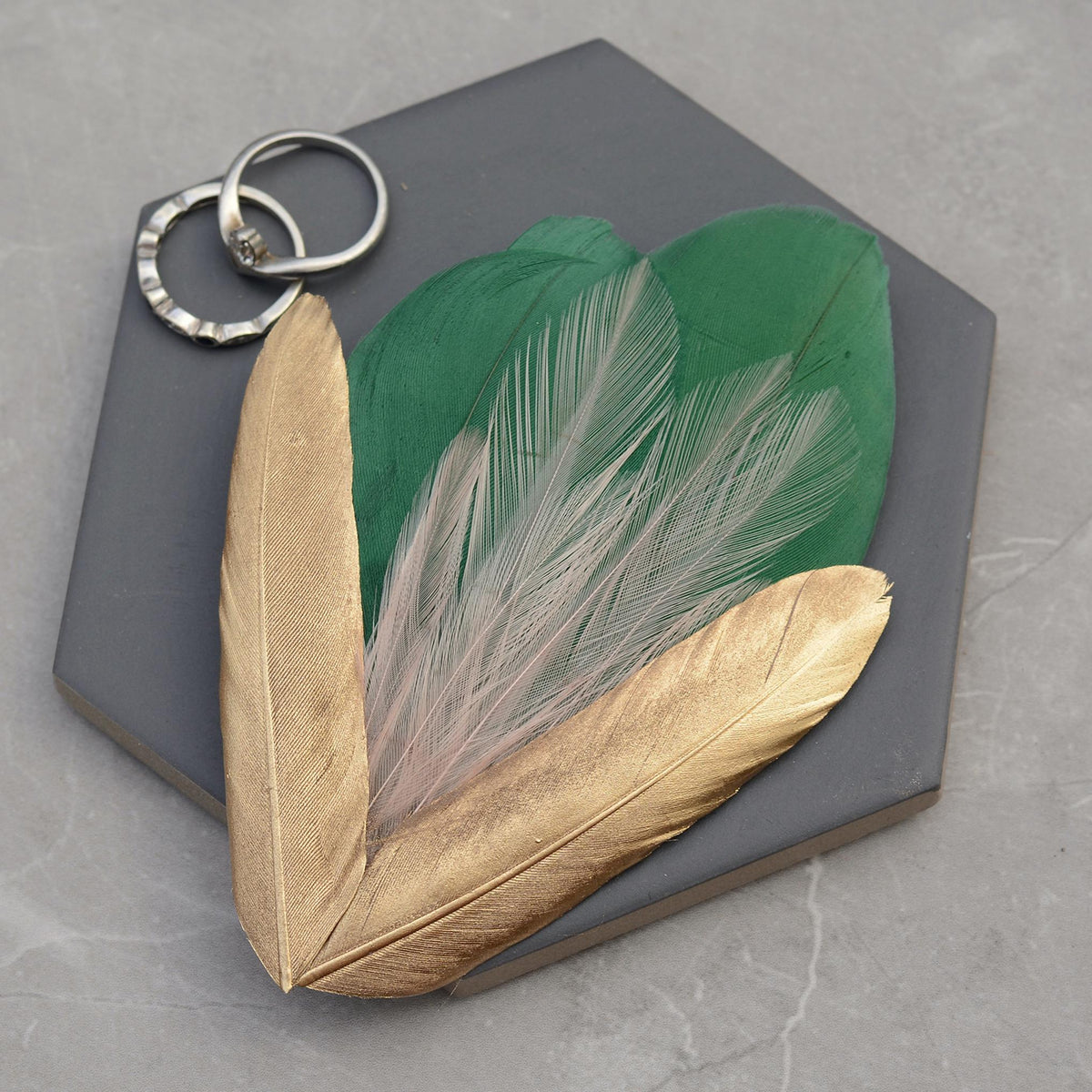Feather hair clip fascinator in green , blush pink and gold
