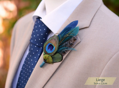 Beige suit with a blue polka dot tie and peacock feather boutonniere.