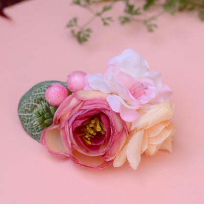 Floral hair accessory with pink and white flowers on a pink background
