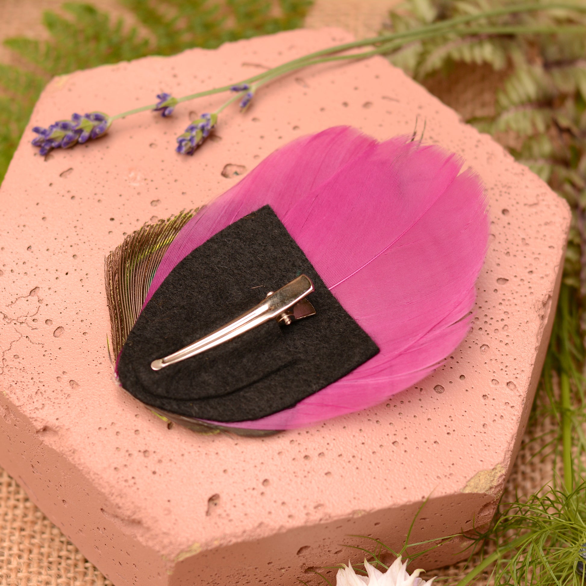 back of purple feather hair clip showing felt base and 4.5cm crocodile style metal clip