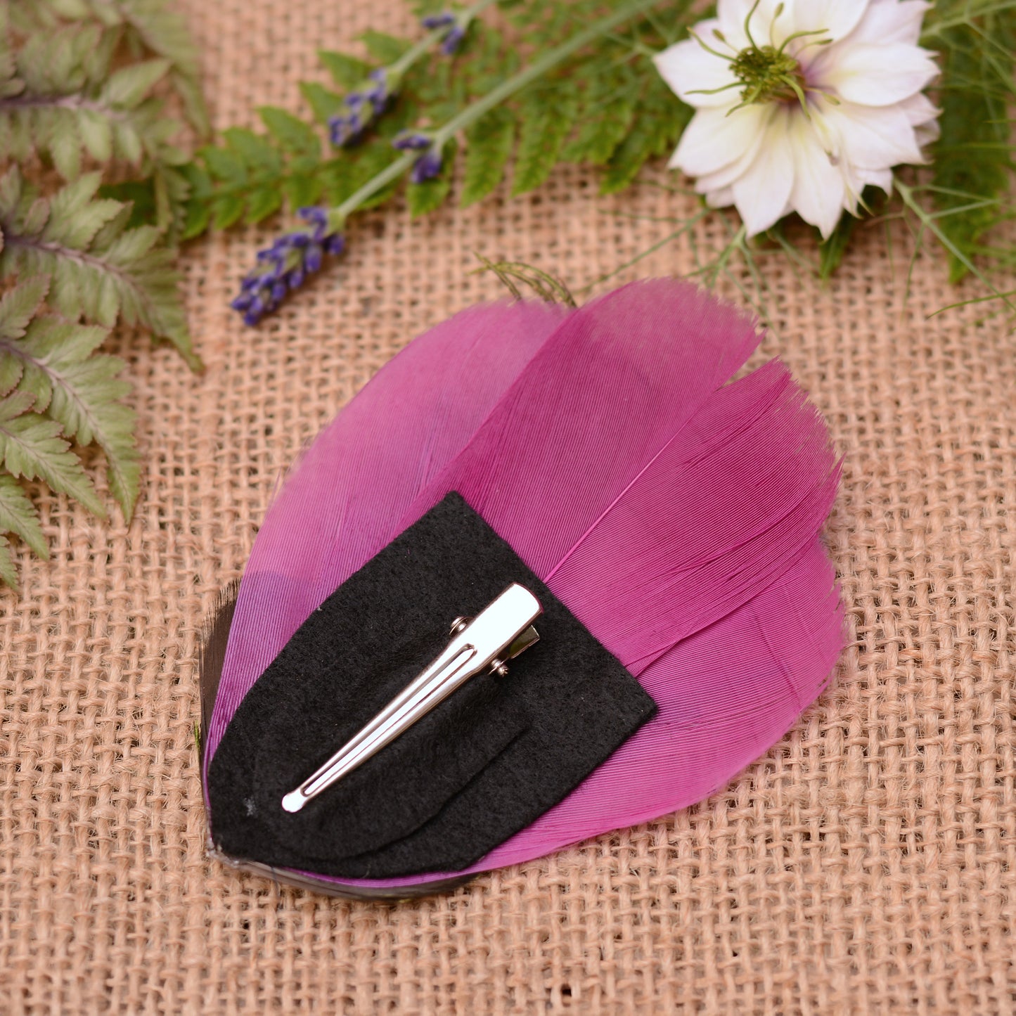 back of purple feather hair clip showing felt base and 4.5cm crocodile style metal clip