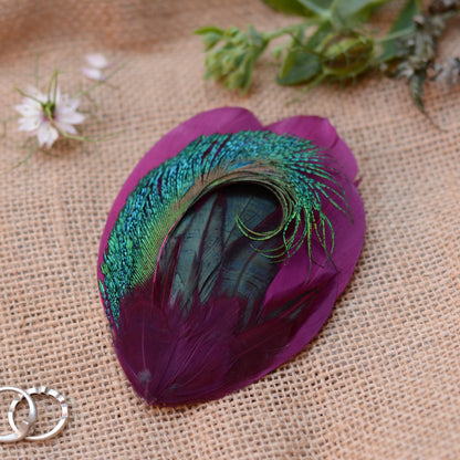 Purple, turquoise and green peacock feather fascinator hair clip. For wedding guests and special events.